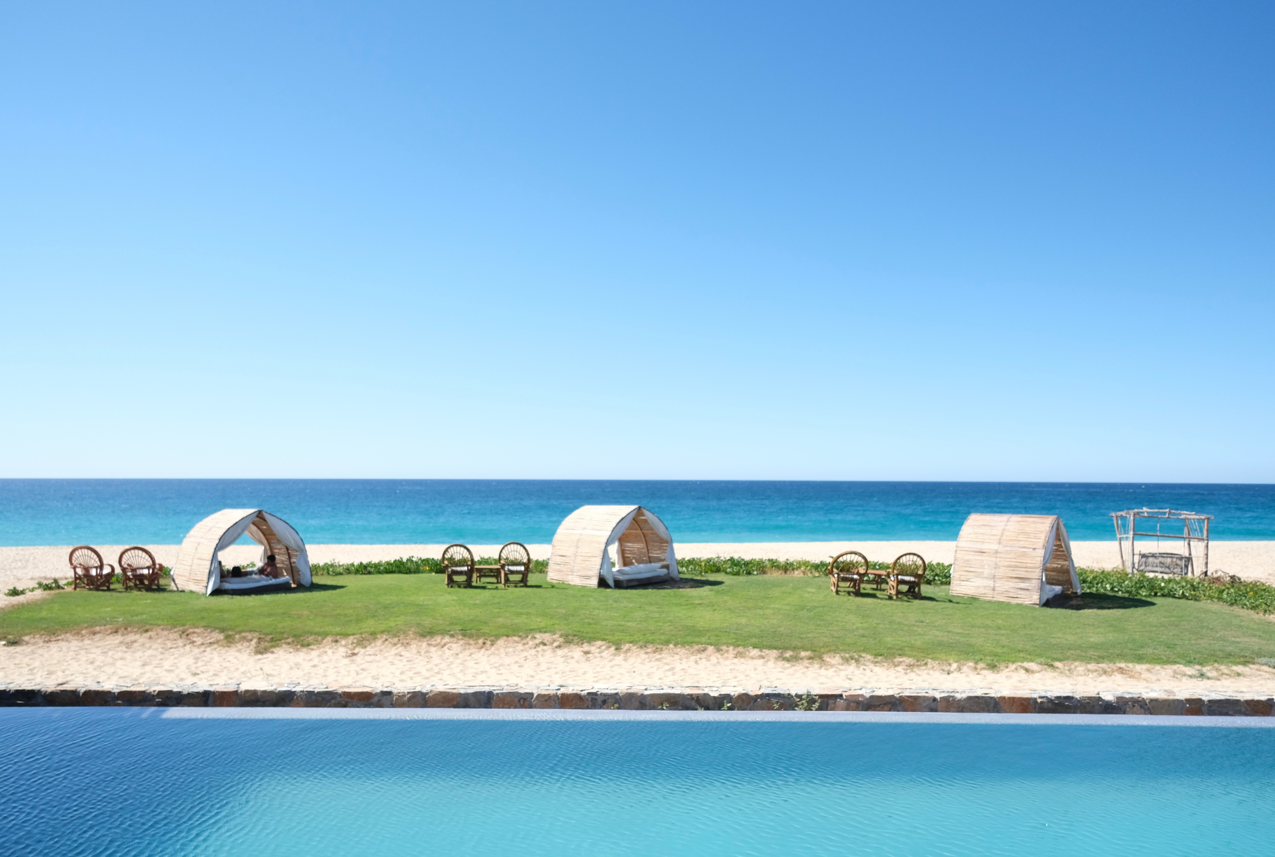 Graphic depicting UI-styled buttons with different categories of interior design items on top of an image of a modern interior living room.